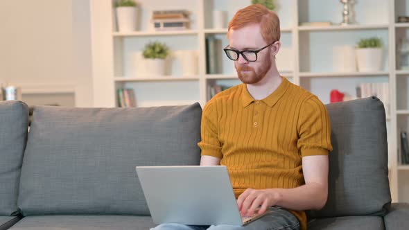 Redhead Man Finishing Laptop Work and Going Away  alt