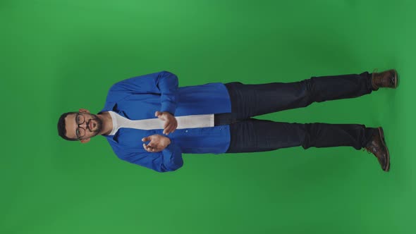 Young Handsome Man with Beard Wearing Casual Clothes Over Green Background Clapping and Applauding alt