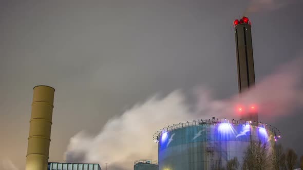 Air pollution from smokestacks at night Time Lapse