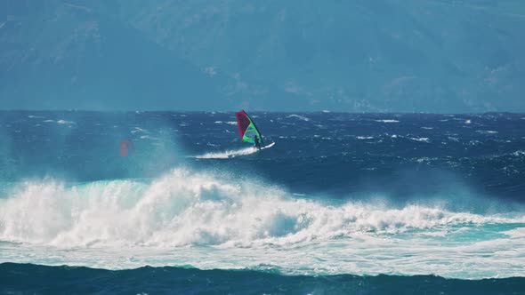 Cinematic View of Windsurfers Sailing Across the Ocean Scenic Jaws Beach  USA alt