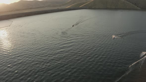 Aerial Drone Tracking Shot of a  Boat and Personal Watercraft on a Lake (Lake Kaweah, Visalia, CA)