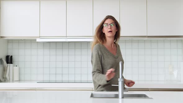 Woman Dancing in Kitchen