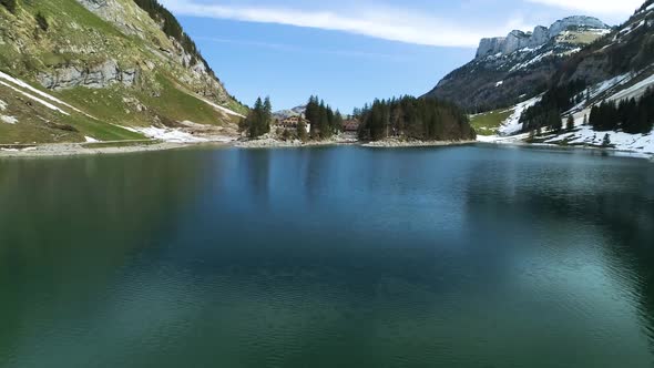 Aerial Flight Over Seealpsee Lake In The Mountains Of Switzerland alt