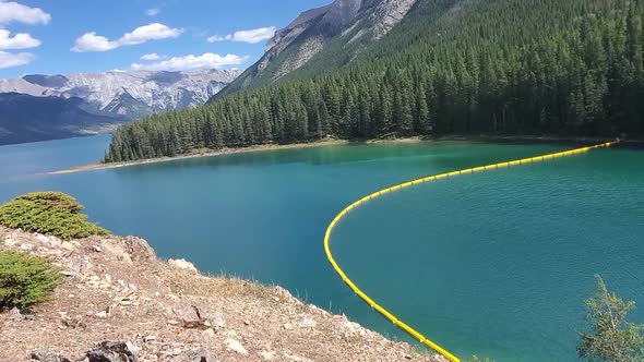 A pan shot of 2 Jack Lakes Dam in Banff National Park