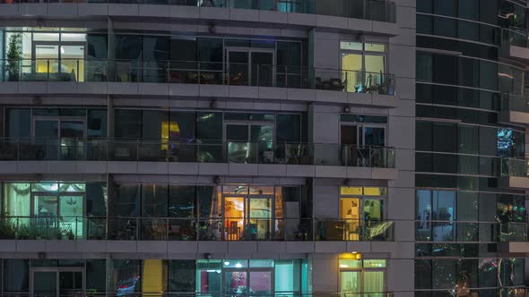Flat Night Panorama of Multicolor Light in Windows of Multistory Buildings Aerial Timelapse alt