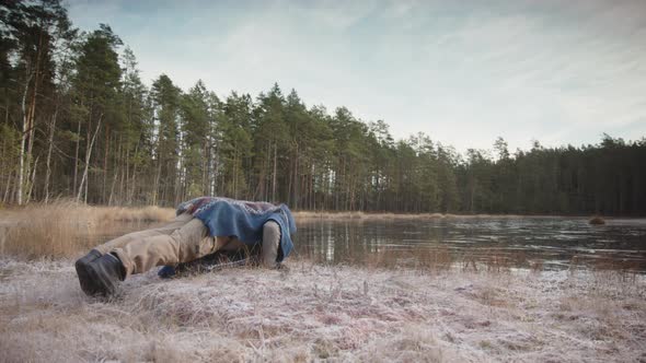 TRACKING shot of a man doing press-ups to warm up before ice bathing alt