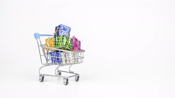 Stop motion animation Shopping cart Shopping trolley full of gifts boxs isolated on white background
