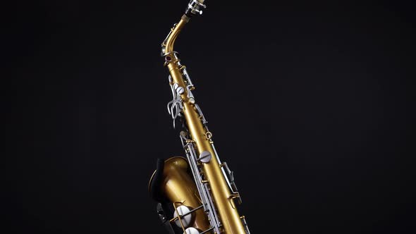 Rotating Golden Saxophone On A Black Background 1.