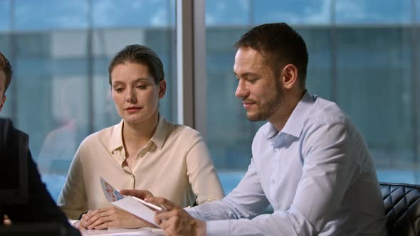 Working team of business people discussing new financial strategies for the coming year alt