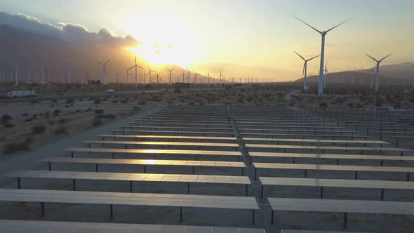 Solar Panels At Sunset And Wind Farm Alternative Energy Choices