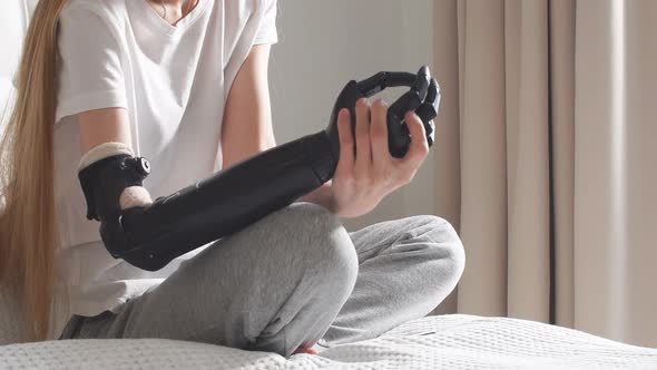 Pensive Serious Girl Having a Cyber Arm alt