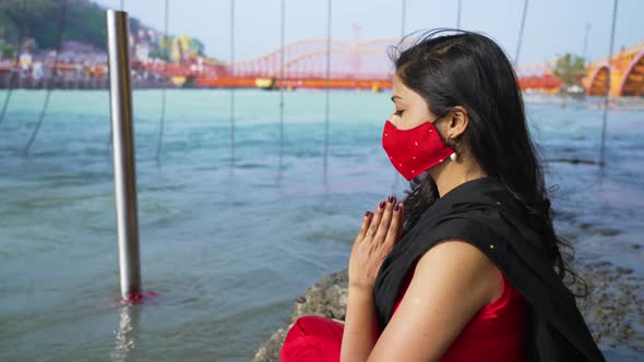 Indian Woman Meditating Wearing Coronavirus Protection Face Mask Sitting in Sadhana or Spiritual