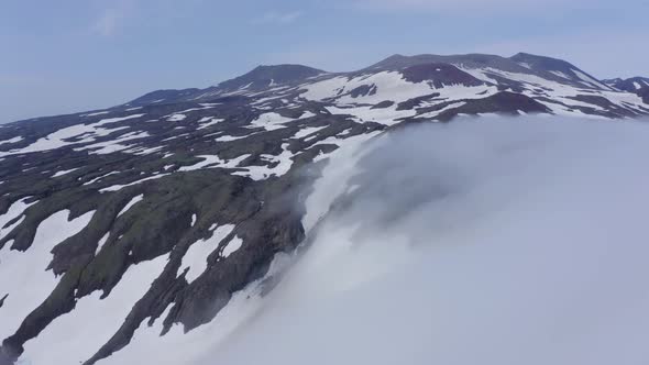 Aerial Footage of the Gorely Volcano Peaks Rising Above the Fog