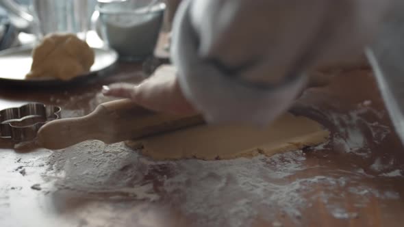 Female Hands Flatting Dough Using Rolling Pin alt