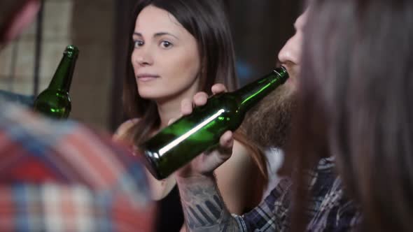 Friends Do Toasts Drink Beer and Cocktails While Having a Good Time Together at a Bar alt