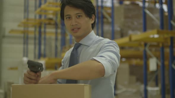 MS TD Man using barcode reader in Logistics warehouse