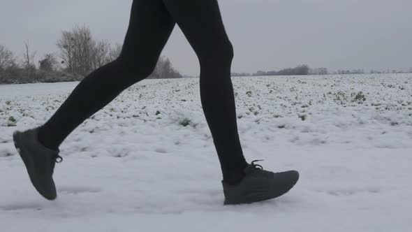 Running Legs on Snow Slow Motion alt