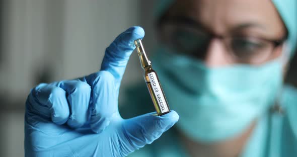 Doctor holding a recipient with the coronavirus COVID-19 vaccine