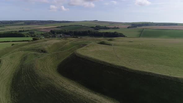 Aerial of the eastern gate of the iron age hill fort, Maiden Castle. Fields in the surrounding lands alt
