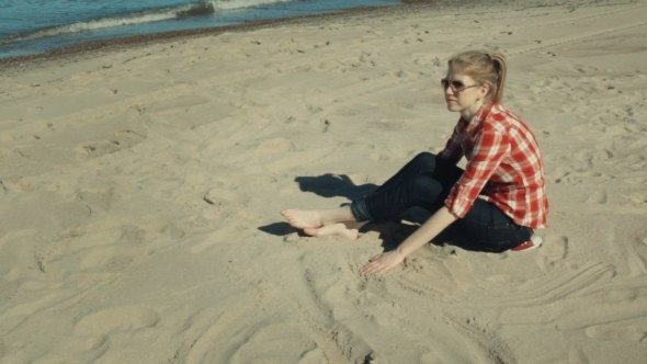 Girl Sitting On the Beach