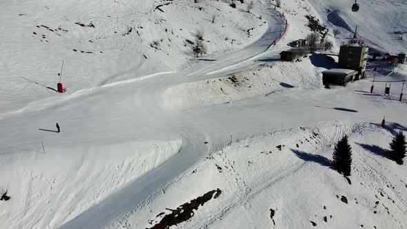 Aerial View of the Alps Mountains in France. Mountain Tops Covered in Snow. Alpine Ski Facilities