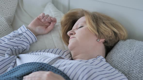 Old Senior Woman Sleeping in Bed alt