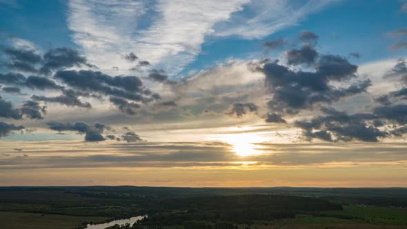 Beautiful Dramatic Fast Lapse Time of Sunset and Clouds in the Blue Orange Sky alt