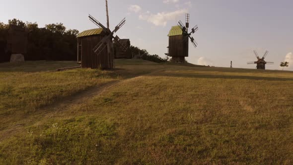 Idle Wooden Mills on the Countryside Field alt
