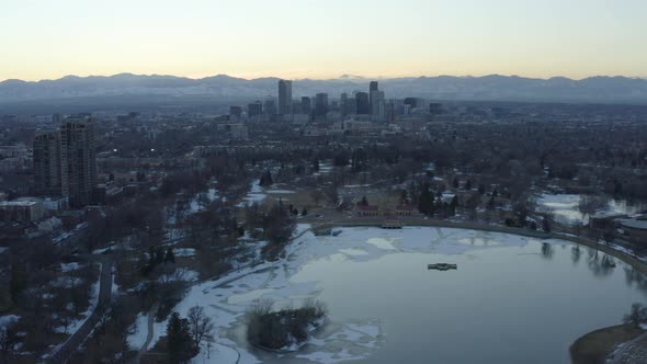 Denver Colorado Frozen Lake Aerial Hyperlapse Sunset Above Colorado Rockies alt
