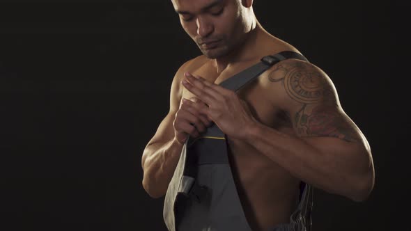 Handsome Sexy African Ripped Male Builder Wearing Constructionist Uniform alt