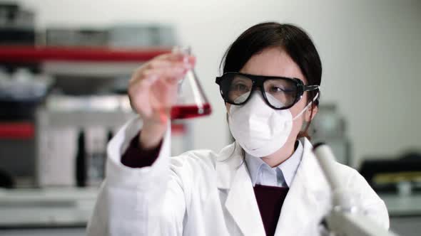 Scientist wearing lab coat working in laboratory