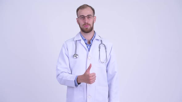 Happy Bearded Man Doctor Giving Thumbs Up