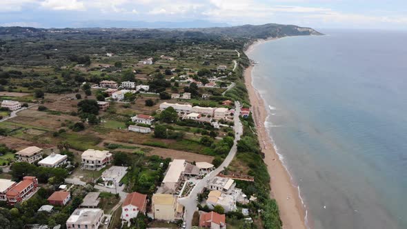 Beautiful aerial footage of the Agios Georgios Beach and coastal village called St George South  alt