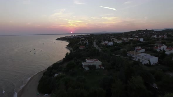 Aerial View of Trikorfo Beach at Sunset, Greece alt