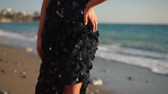 Camera Goes Up Slim Confident Caucasian Female Dancer Posing in Sunshine on Mediterranean Sea Beach alt