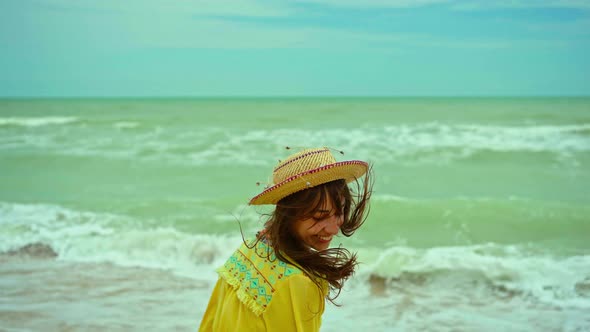 Portrait Happy Expression Woman with Blowing Hair Wearing Yellow Shirt Having Fun on Beach and alt