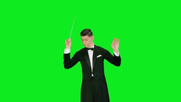 Symphony Orchestra Conductor Wearing Suit is Directing Musicians with Movement of Baton Isolated on alt