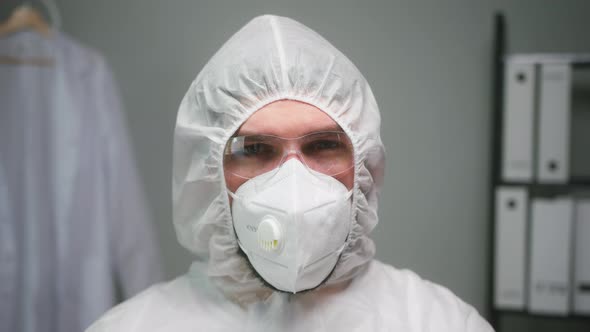 Closeup of Overworked Doctor or Researcher Dressed in Protective Suit Ppe Mask in Laboratory in alt