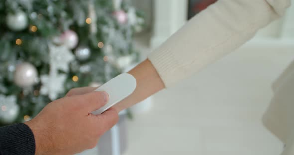 COVID-19 Body Temperature Measuring for Coronavirus. A Woman's Temperature Is Taken for Controlling alt