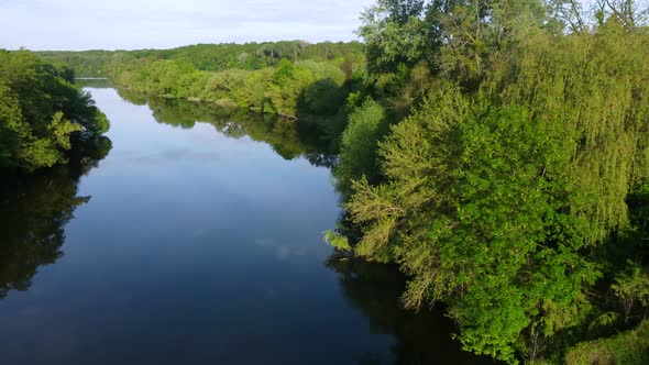 Aerial Drone View Flight Over Mirror Smooth Surface of River and Trees alt