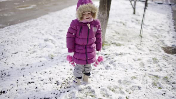 Girl Child Preschooler Winter Outdoors Snowfall alt