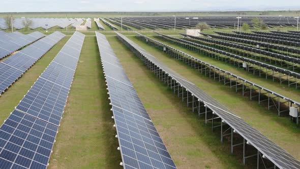 Solar Panels Quadrocopter Flight Over a Field Along