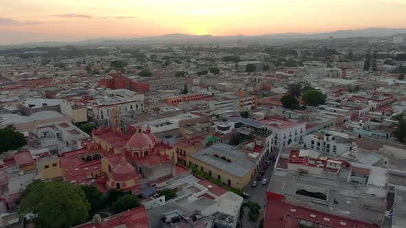 Fly Over Our Lady Of Guadalupe To San Antonio de Padua Templo At Sunset In Santiago de Querétaro, Me alt