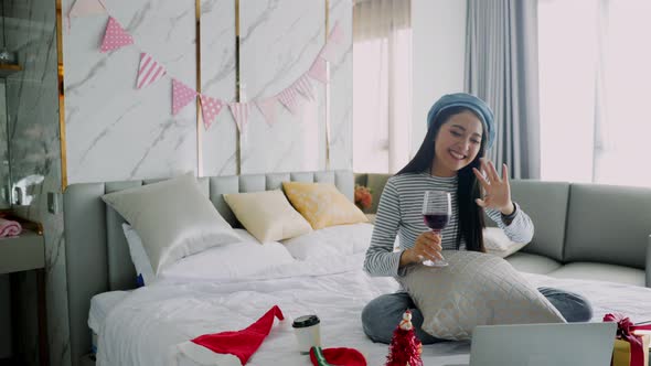 The woman received a Christmas present at home. Excited woman with Christmas Gift alt