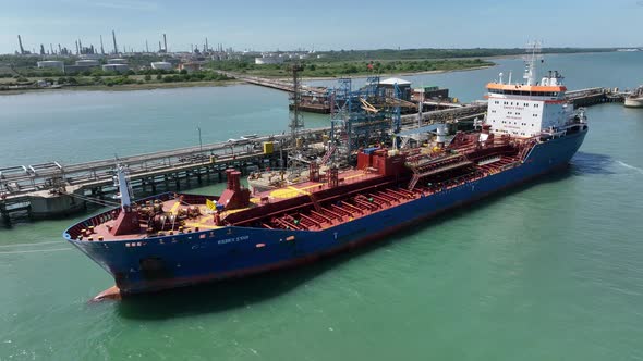 Fuel Tanker Vessel Offloading Petroleum Cargo for Processing at a Refinery alt