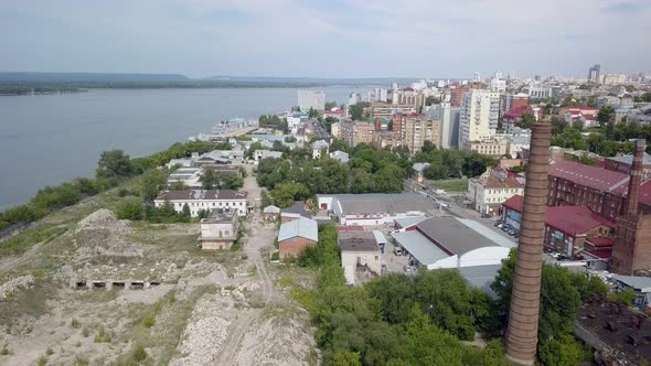 Industrial and Living Area in City Near River in Summer Day, Aerial View