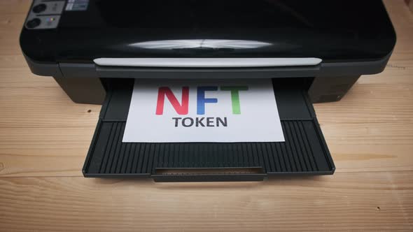 NFT Token Printing Inscription on White Sheet of Paper Printed By a Jet Printer alt