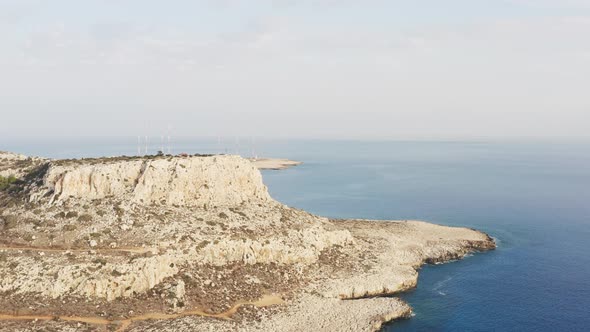 Aerial View of the Rocky Shore of the Sea Against the Rocks alt