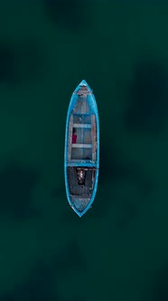 Aerial view to a old fishing boat in sea alt
