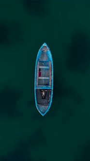 Aerial view to a old fishing boat in sea